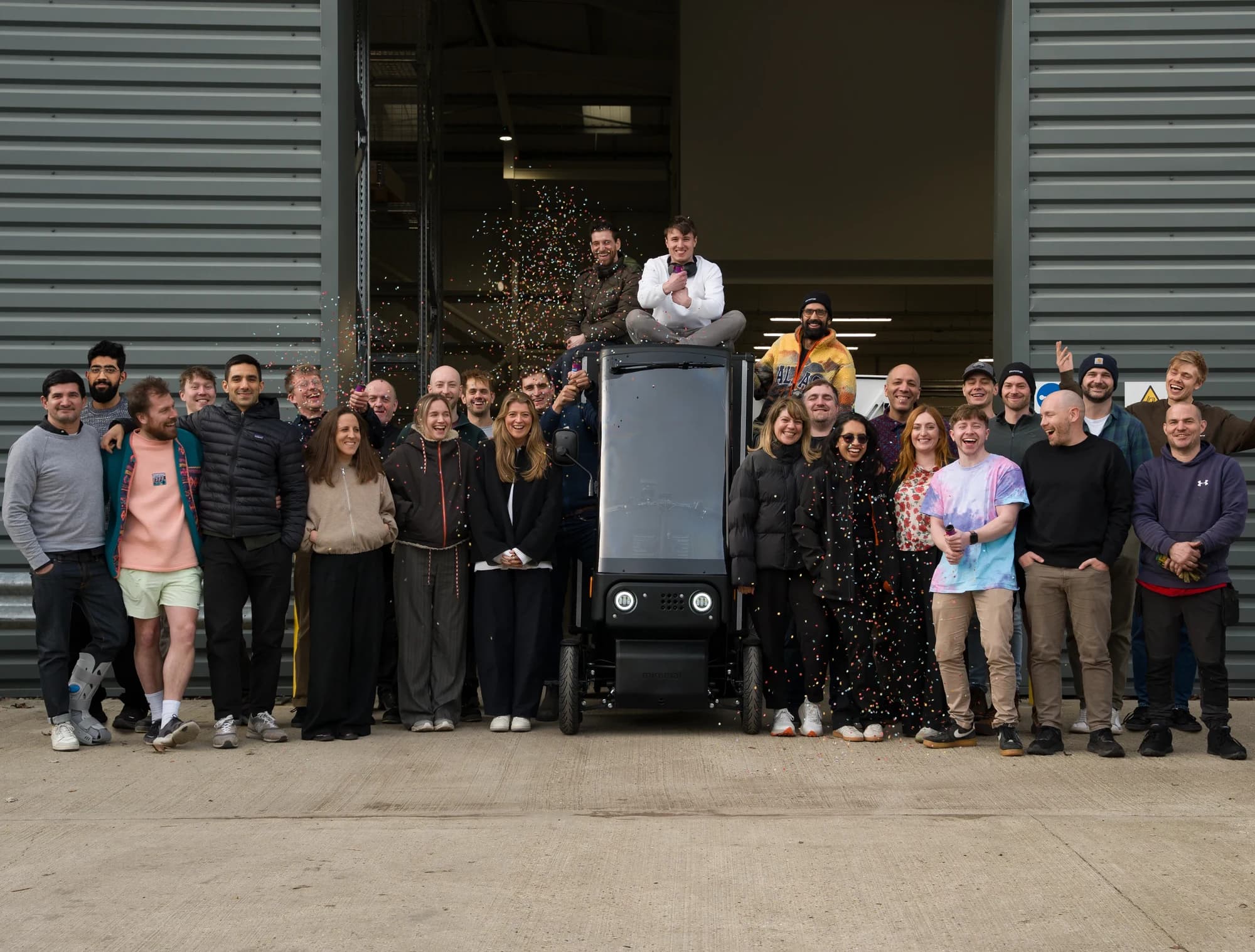 The Minimal team standing together in front of their workshop